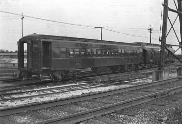 Passenger Car 334 and Wooden RPO Car-Storage Yard-Richmond Hill-View SW - 09-1913 (Keller).jpg (114834 bytes)